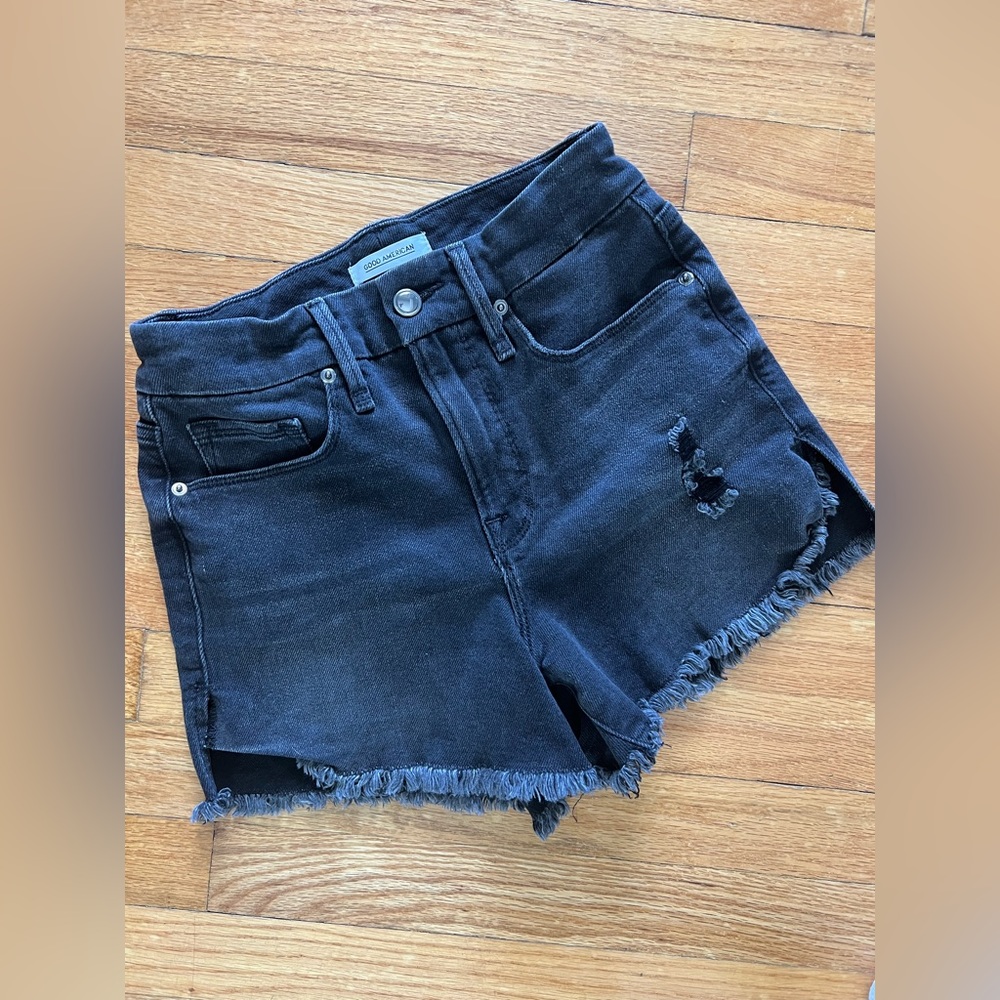 Good American high waisted distressed raw hem denim shorts